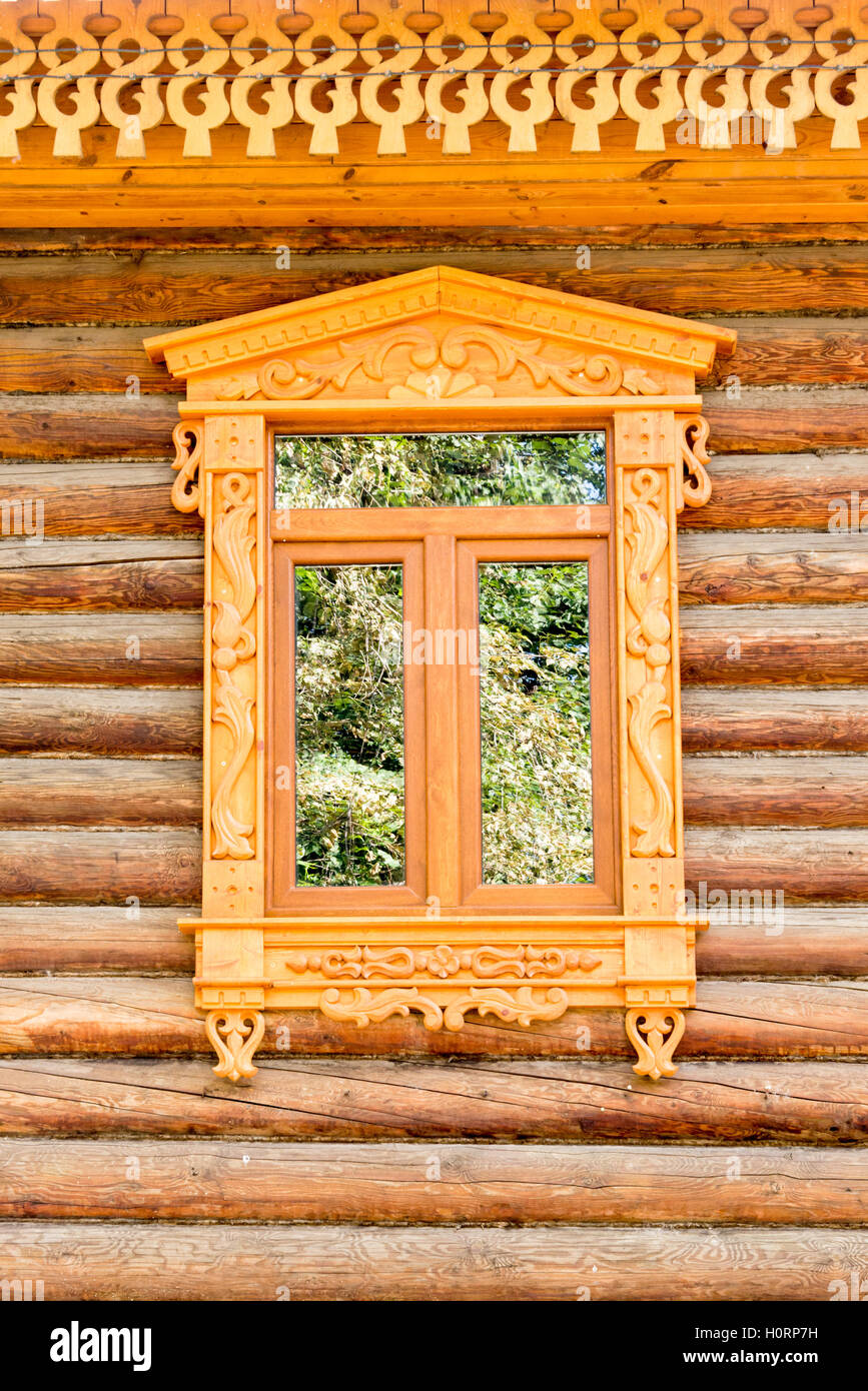 Detail of a window of a traditional wood log house in Vladimir, Golden ring,  Russia Stock Photo