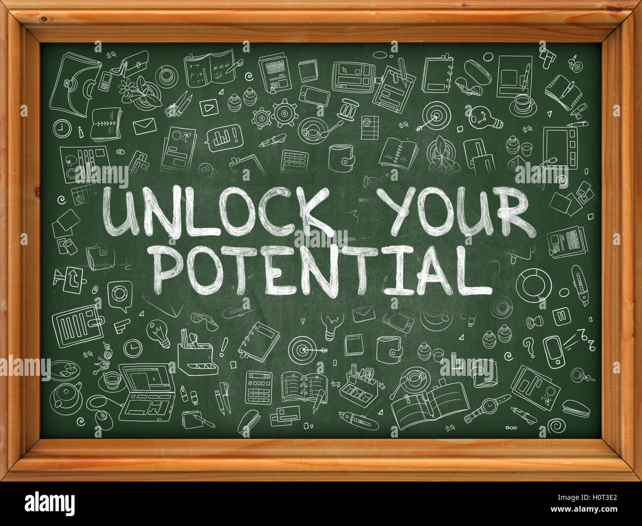 Hand Drawn Unlock Your Potential on Green Chalkboard. Stock Photo