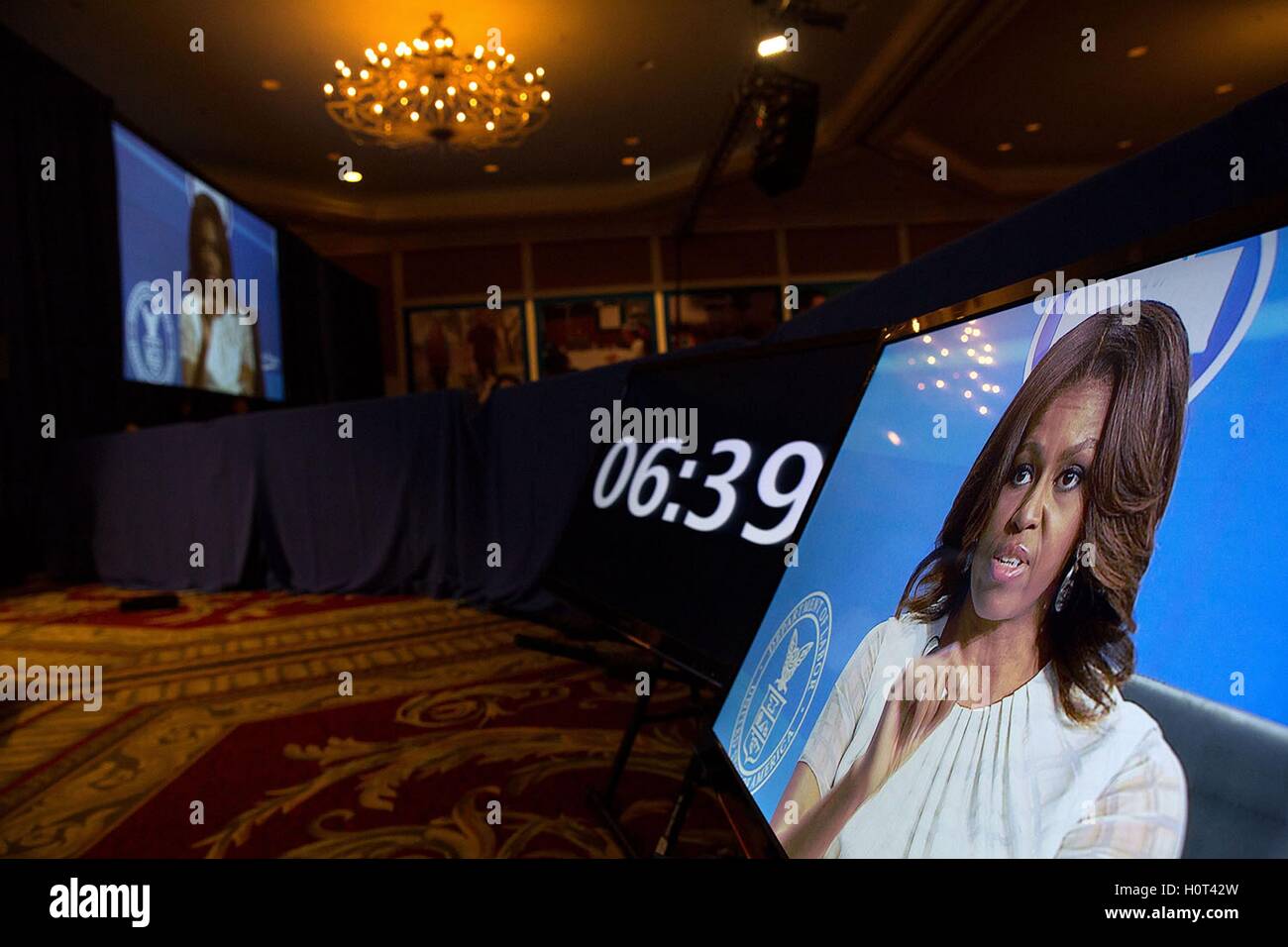 Television monitors show First Lady Michelle Obama as she participates in a conversation during the White House Summit on Working Families at the Omni Shoreham Hotel June 23, 2014 in Washington, DC. Stock Photo