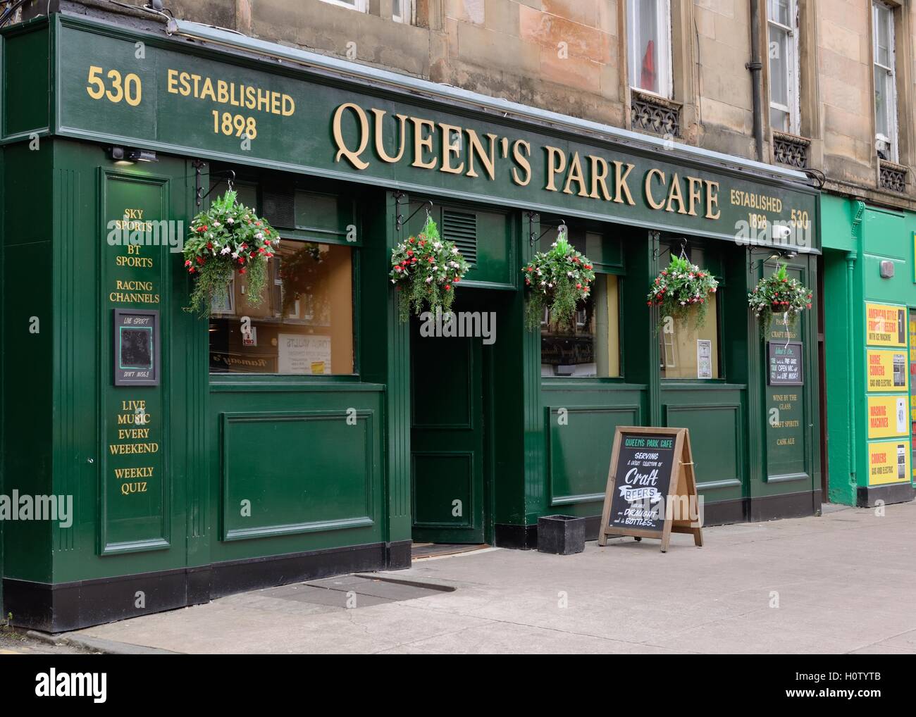 The public bar 'Queen's Park Cafe' on Victoria Road, Glasgow, Scotland, UK Stock Photo