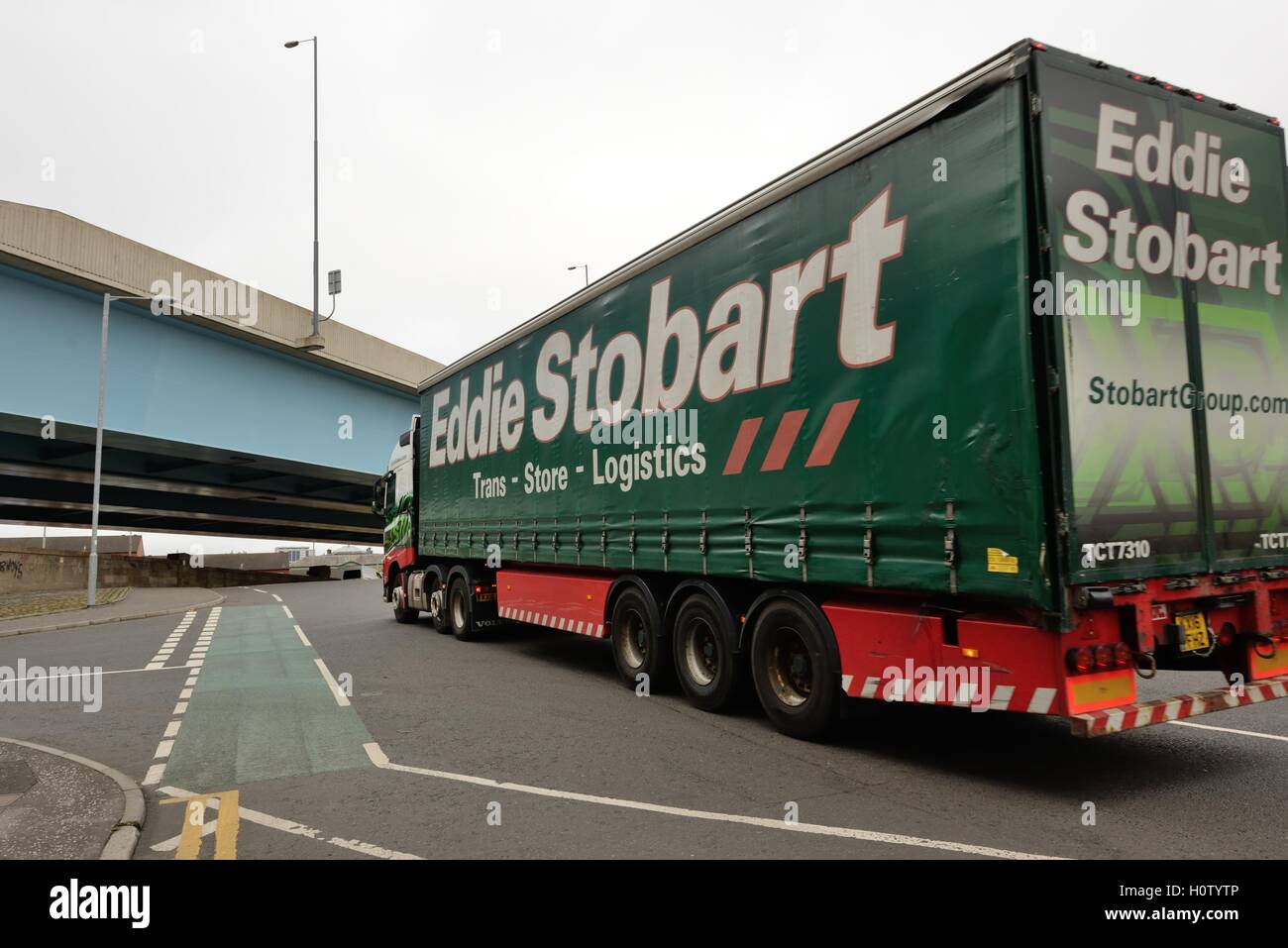 An Eddie Stobart articulated lorry approaches M74 flyover in Glasgow, Scotland, UK Stock Photo