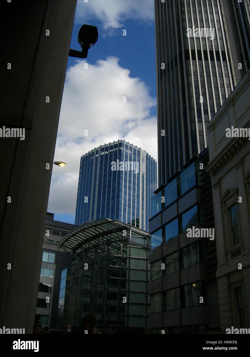 Buildings and blue sky with clouds Stock Photo - Alamy