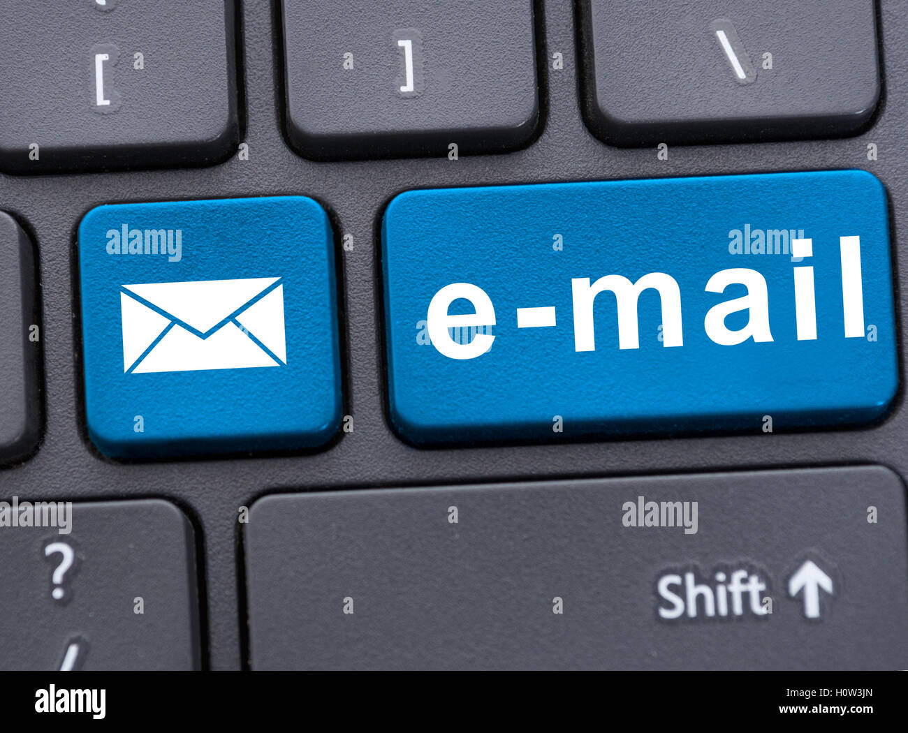 Closeup picture of email button with message on keyboard of modern laptop Stock Photo