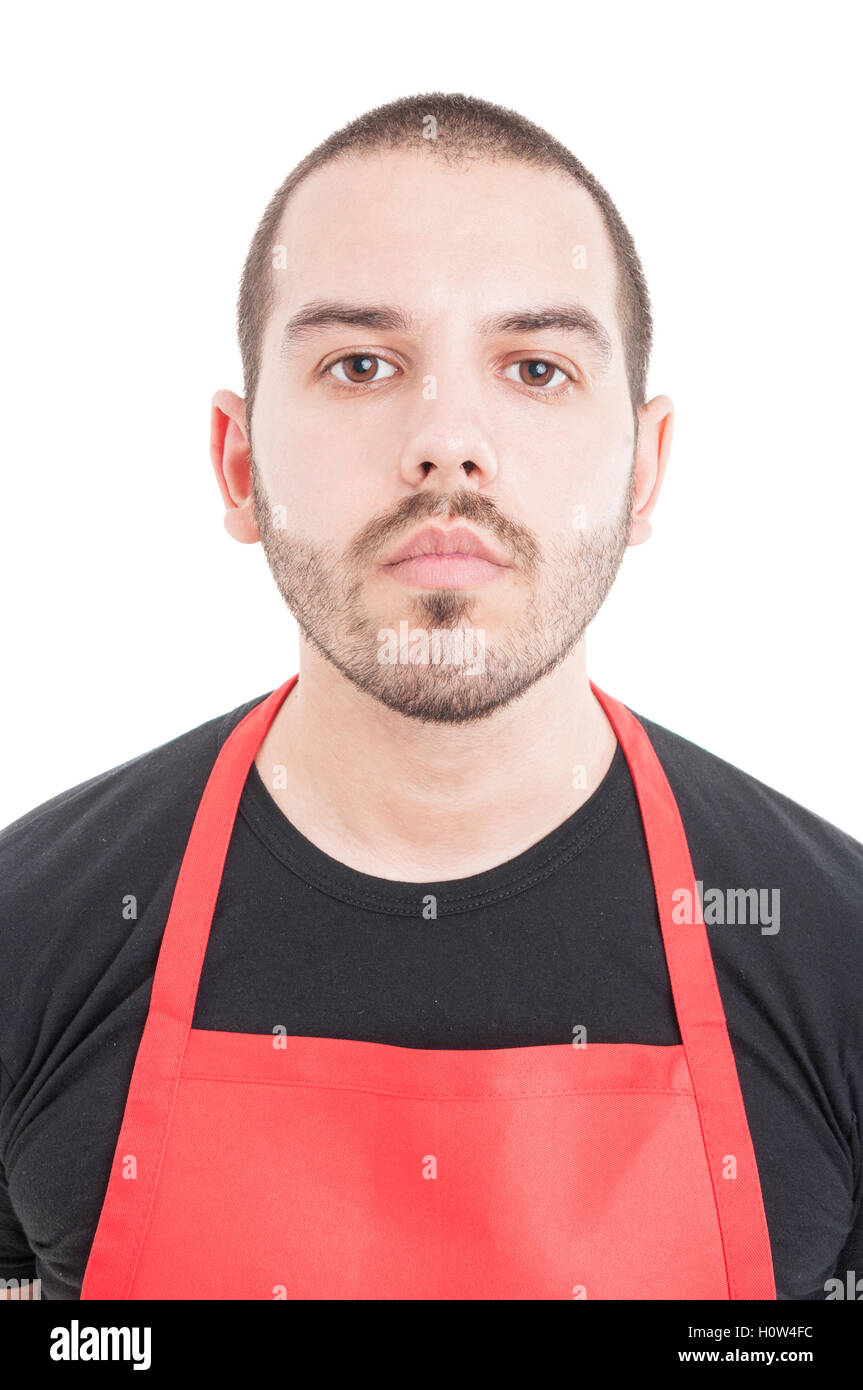 Closeup portrait of young supermarket employee with red apron isolated