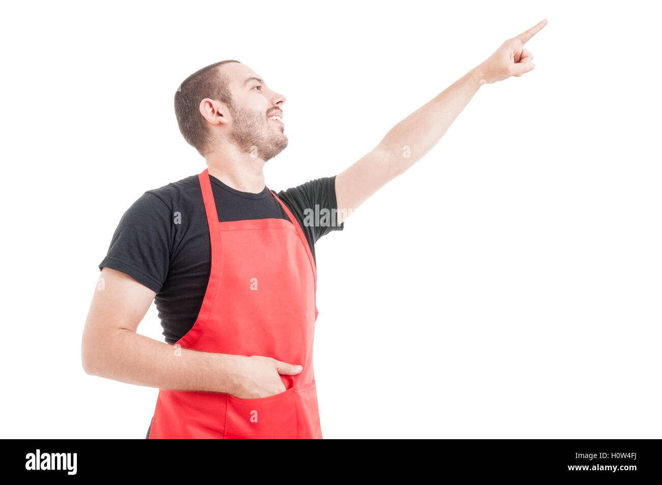 Friendly hypermarket employee pointing up or showing something isolated on white background Stock Photo