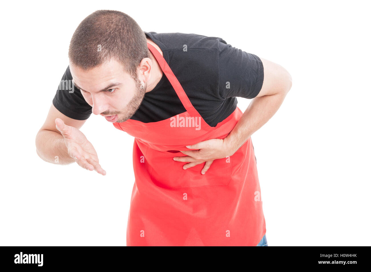 Young supermarket seller feeling nausea and having stomachache on white background Stock Photo