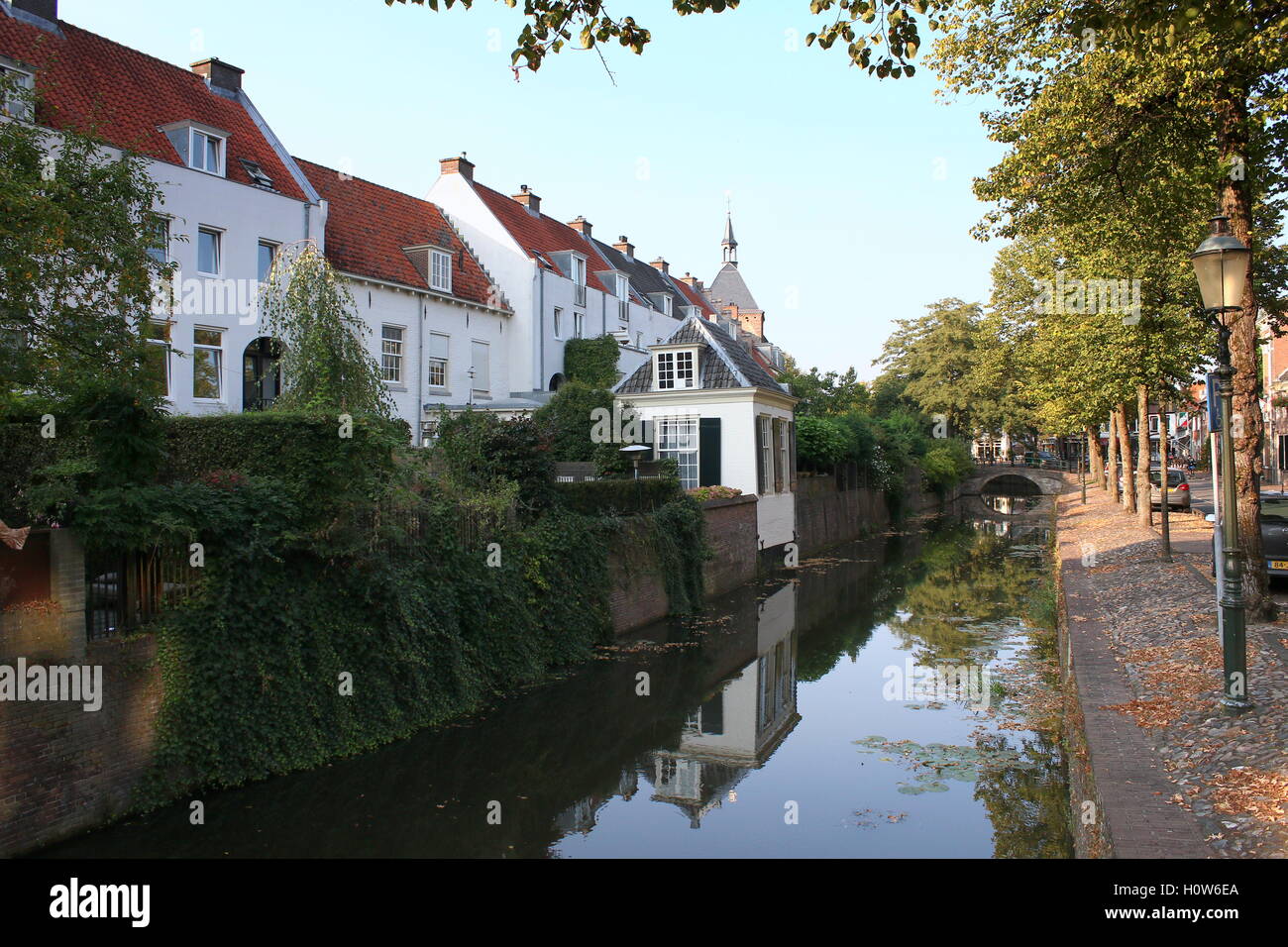 Backyards of old houses along Muurhuizen street in old city centre of Amersfoort, Netherlands. Reflected in  Zuidsingel canal Stock Photo