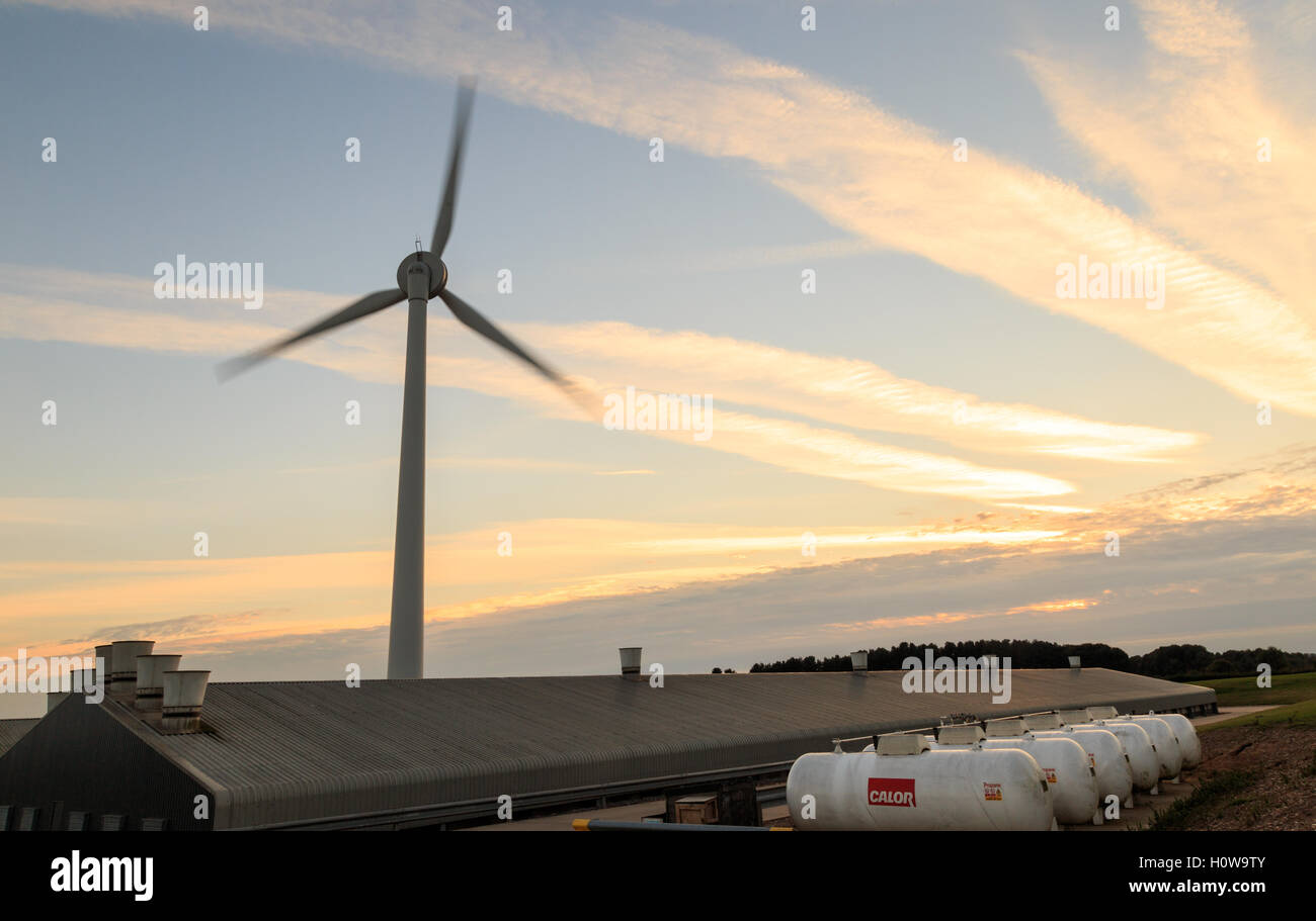 Wind turbine Calor propane gas tanks and industrial units. In Rainworth, England. Stock Photo