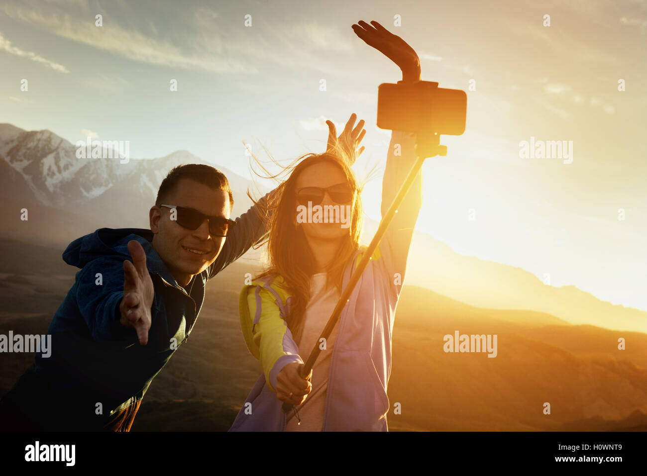 Happy couple having fun on sunset Stock Photo