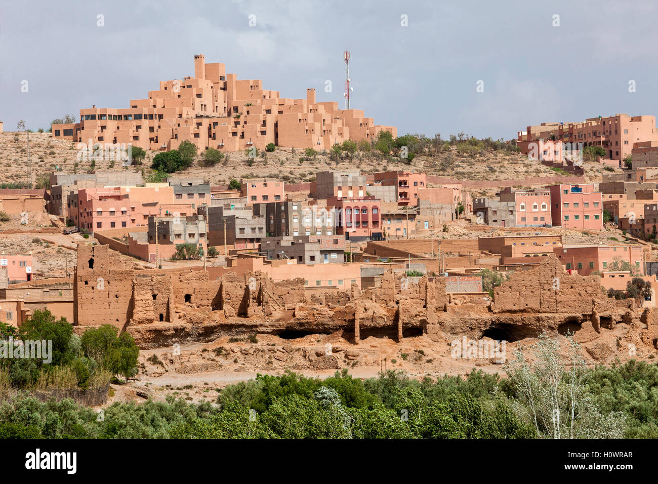 Boulmane, Morocco.  Hotel Xaluca at top, Modern Apartments in Middle, Abandoned Traditional Houses at Bottom. Stock Photo