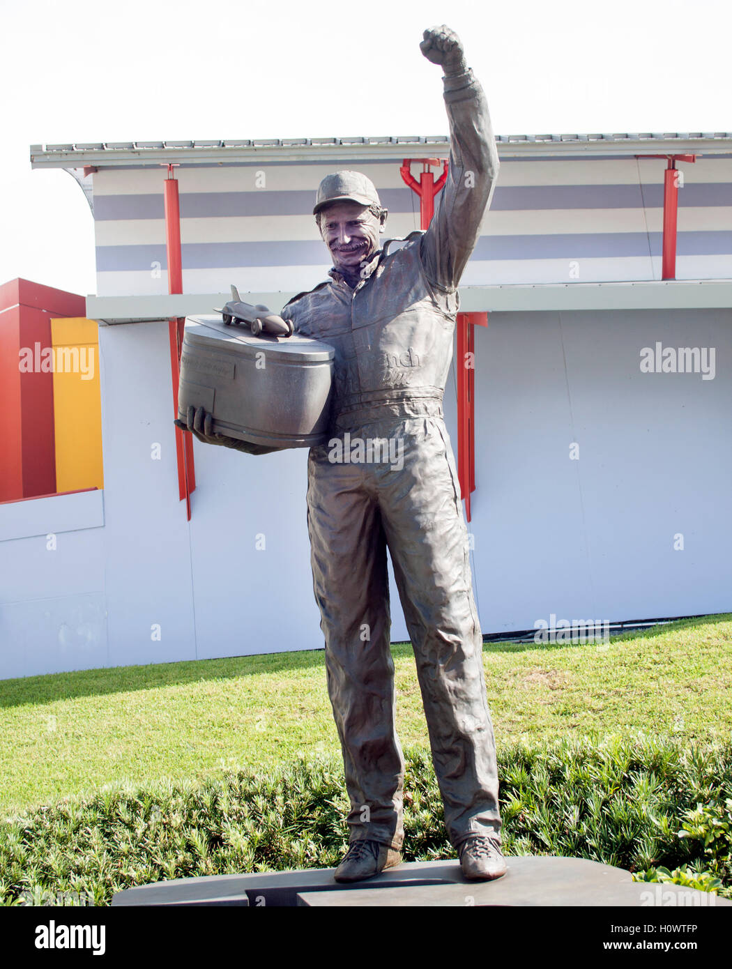 Bronze statue of racing legend Dale Earnhardt Sr. at Daytona Beach, Florida, honoring the NASCAR icon’s enduring legacy. Stock Photo