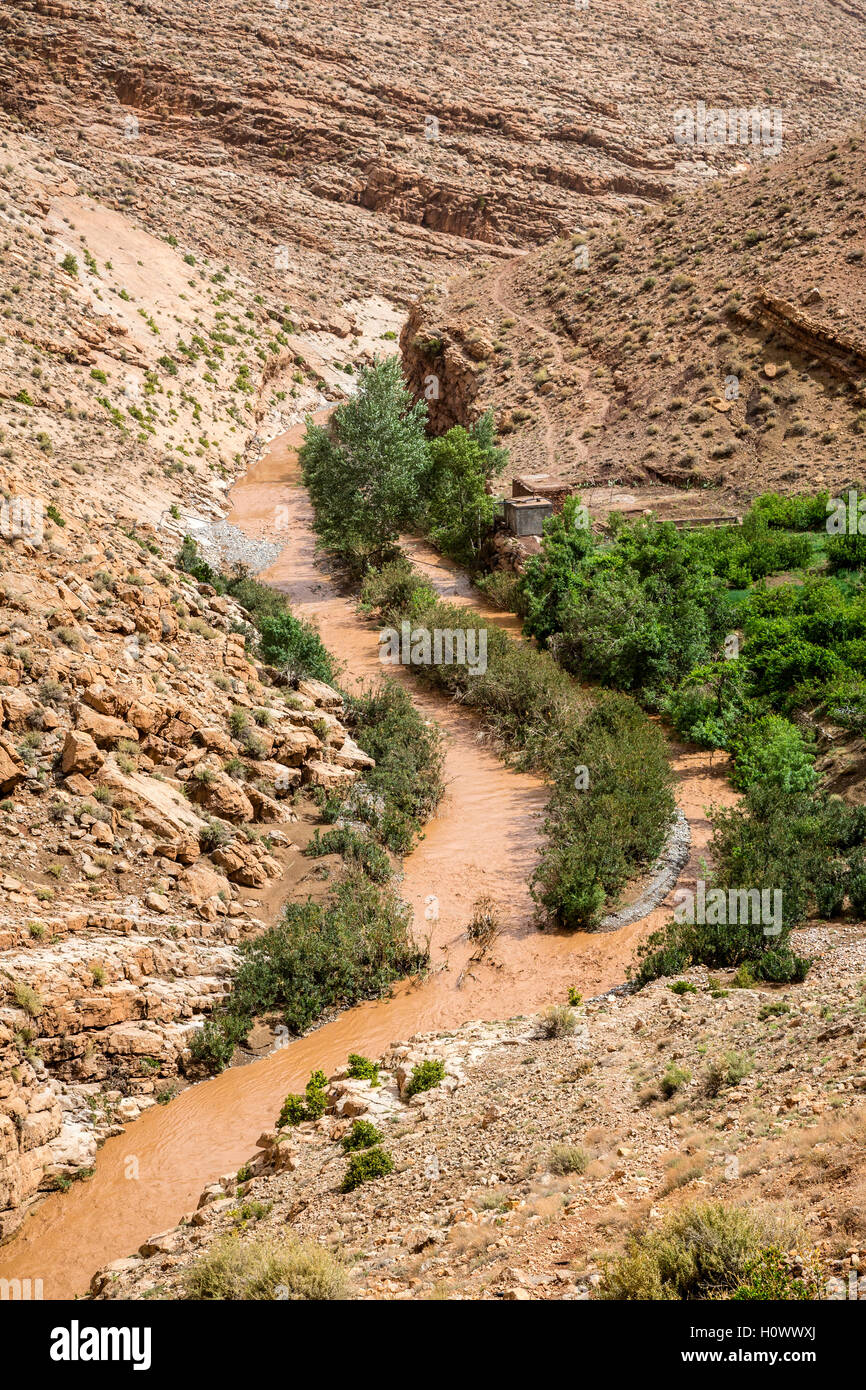 Dades Gorge, Morocco.  Muddy water in the Dades Gorge Results from Rain in the Distance. Stock Photo