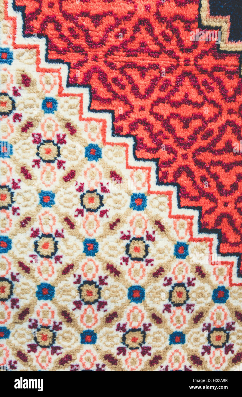 Armenian traditional carpets with traditional ornaments and patterns for sale in Yerevan Armenia. Old fashioned sepia colors. Stock Photo
