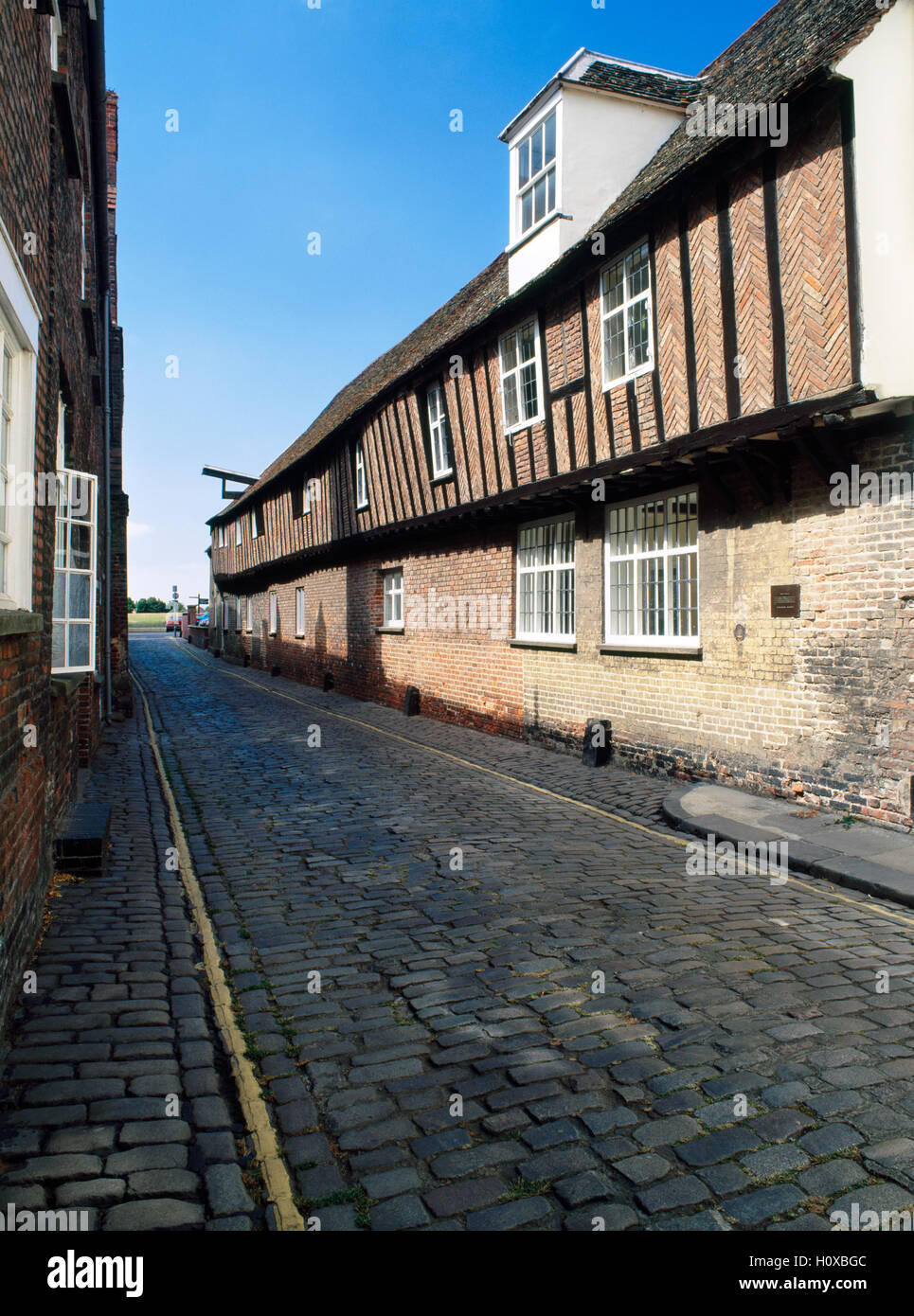 Hanseatic warehouse lining a narrow lane leading down to the River Great Ouse, built c 1475. Kings Lynn, Norfolk, England, UK Stock Photo