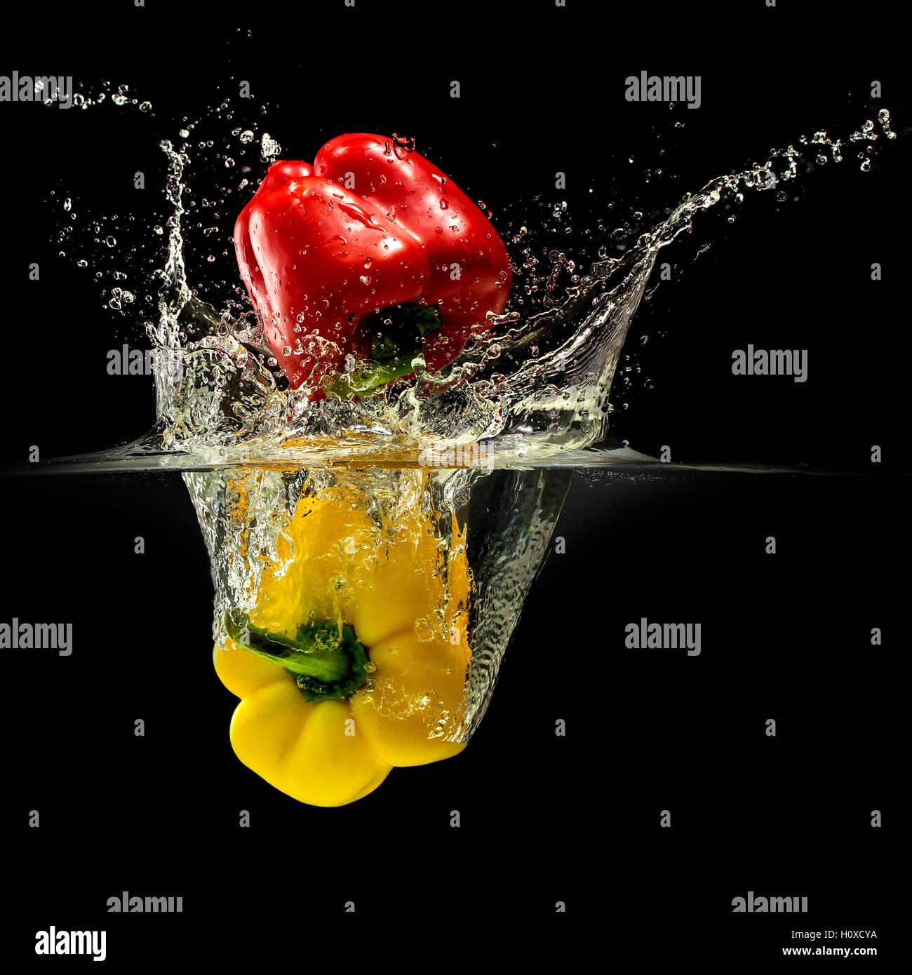 Group of bell pepper falling in water on black Stock Photo Alamy