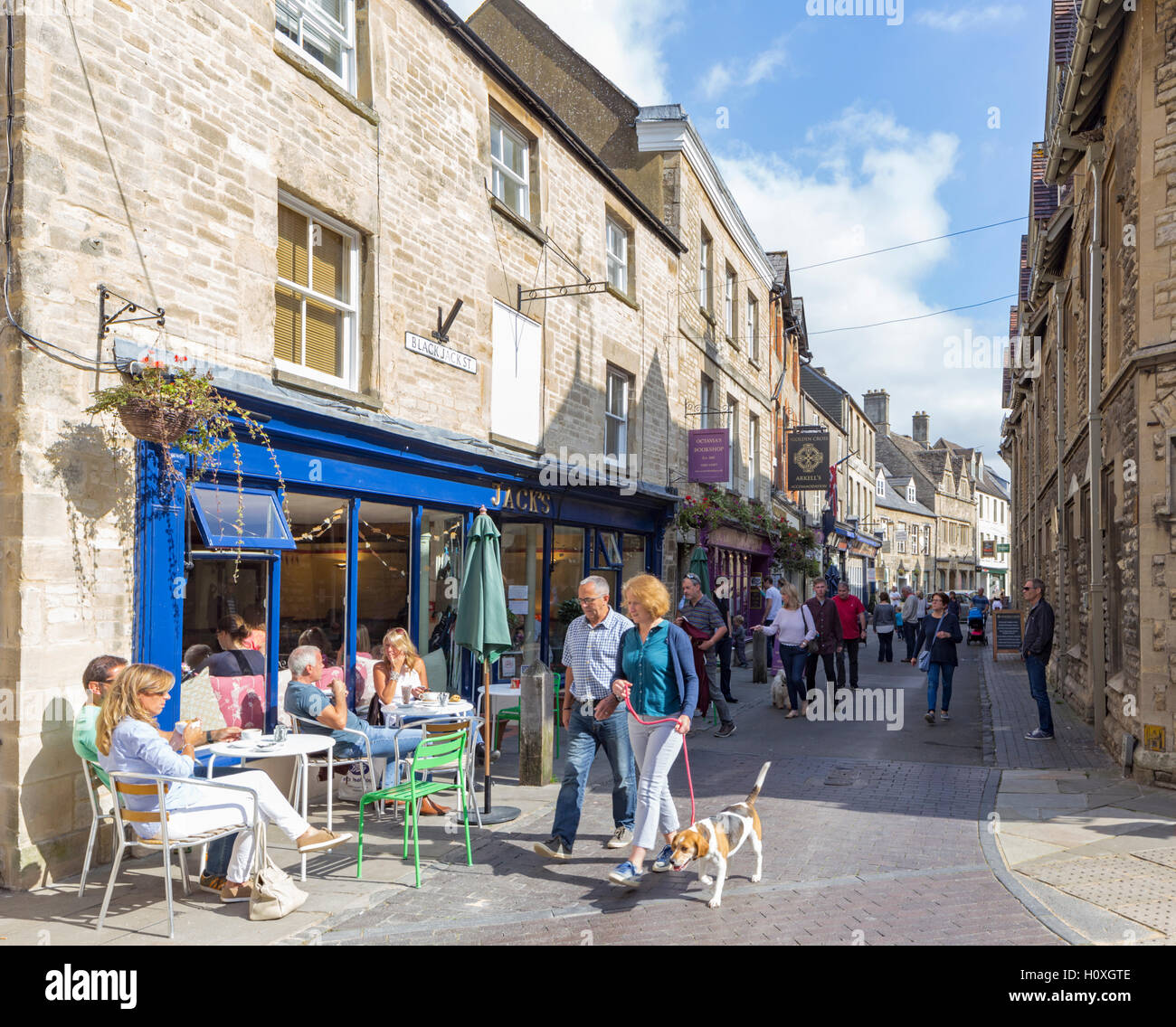 Attractive shops and cafe in the Cotswold town of Cirencester, Gloucestershire England, UK Stock Photo