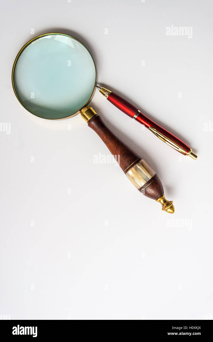 Ballpoint Pen and Magnifier Stock Photo Alamy