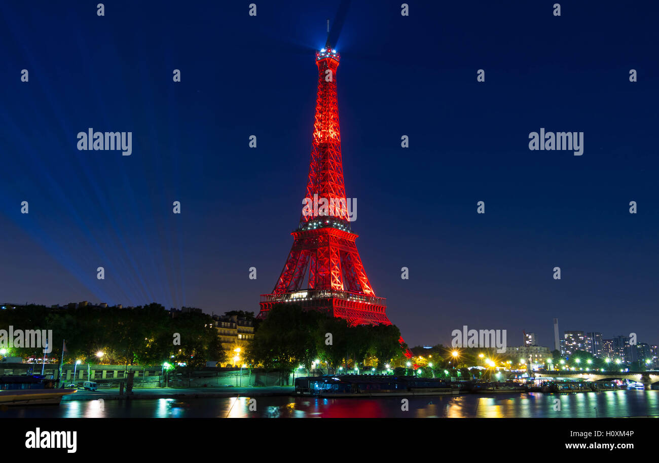 paris; FranceJune 09, 2016 The Eiffel tower lit up in red color for