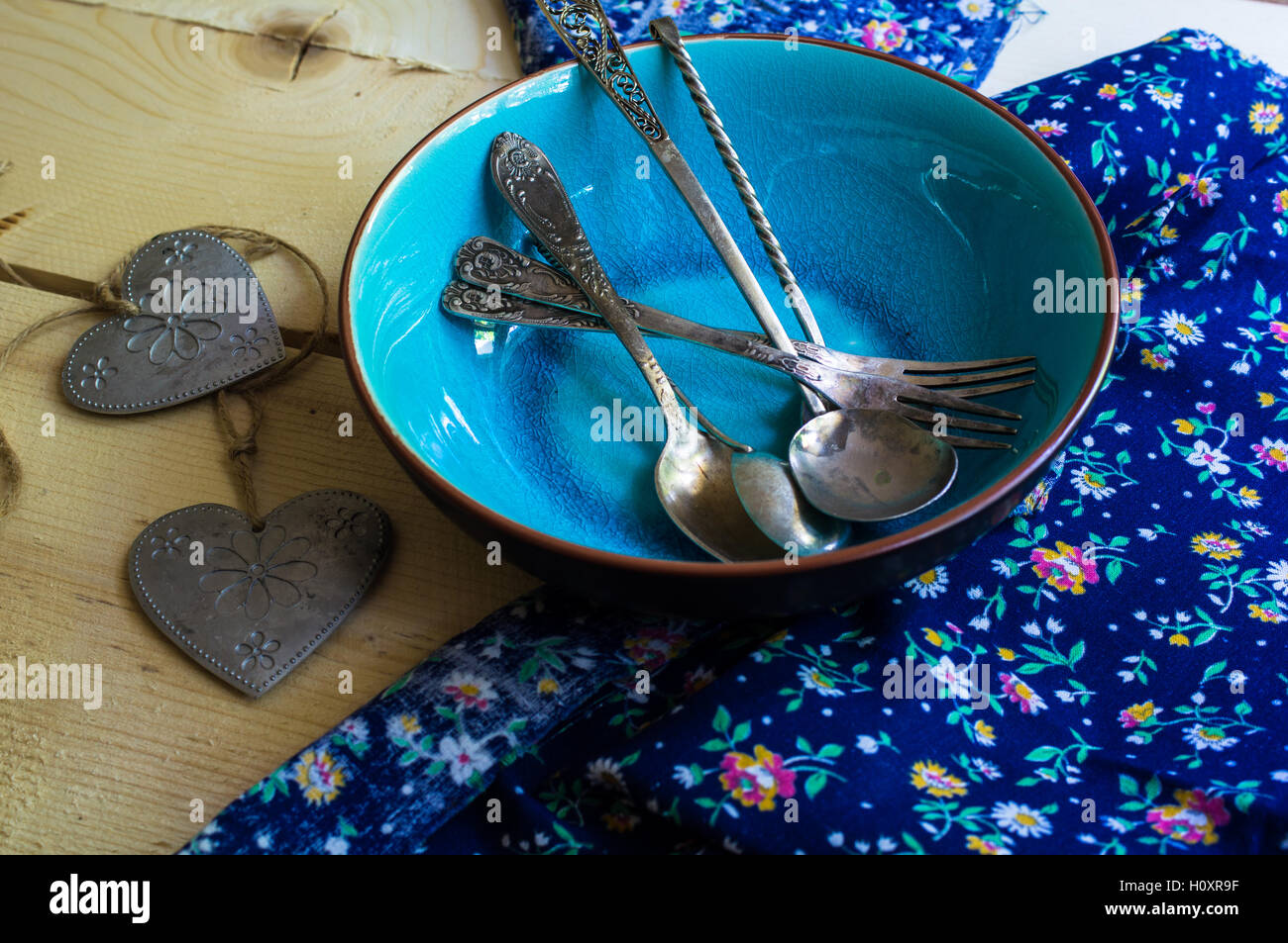 Rustic table setting with vintage silverware ad plates on old styled ...