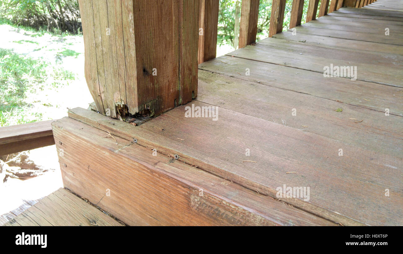 Rotten wood on porch column supports Stock Photo