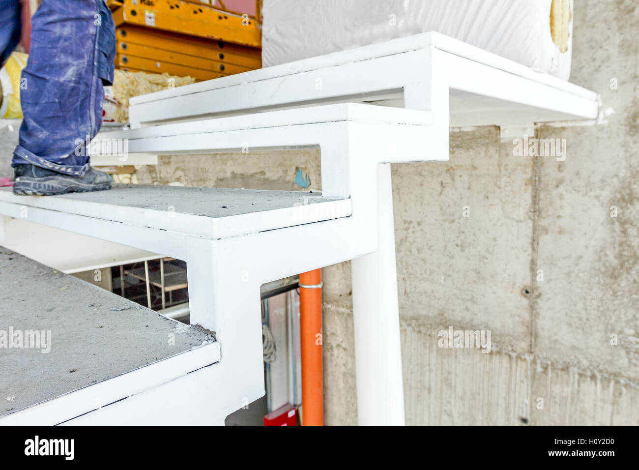 Detail on metal stairway step in a new unfinished modern building. Stock Photo