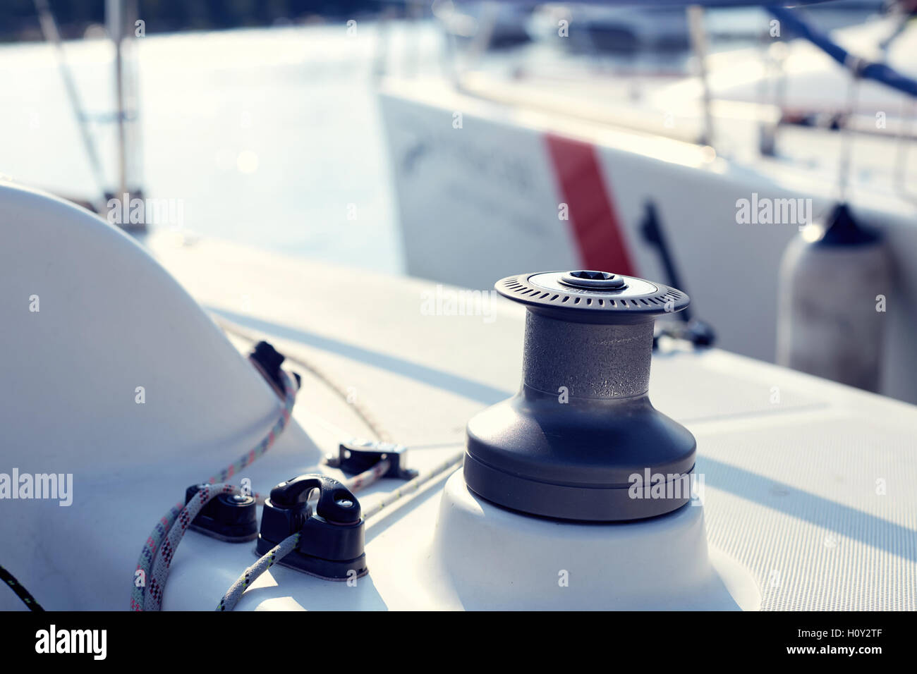Grey winch on the white yacht without hawser Stock Photo