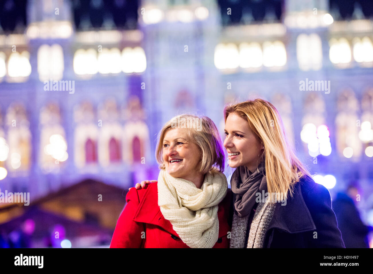 Two beautiful women on a walk in illuminated night city Stock Photo - Alamy