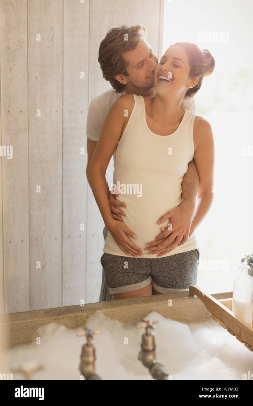 laughing pregnant couple kissing bubble bath Stock Photo - Alamy