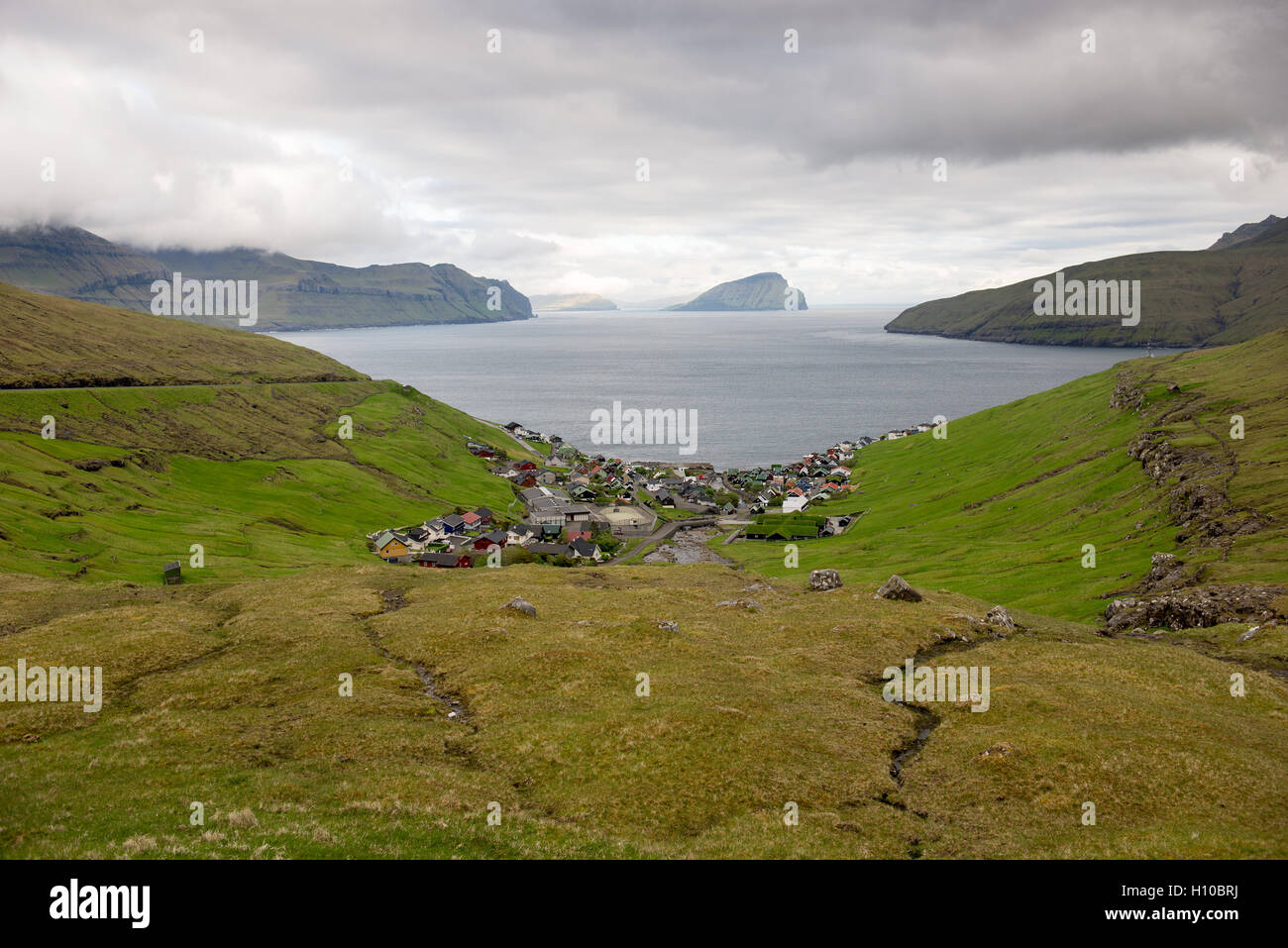 Kvivik on the Faroe Islands with the island Koltur in the background Stock Photo