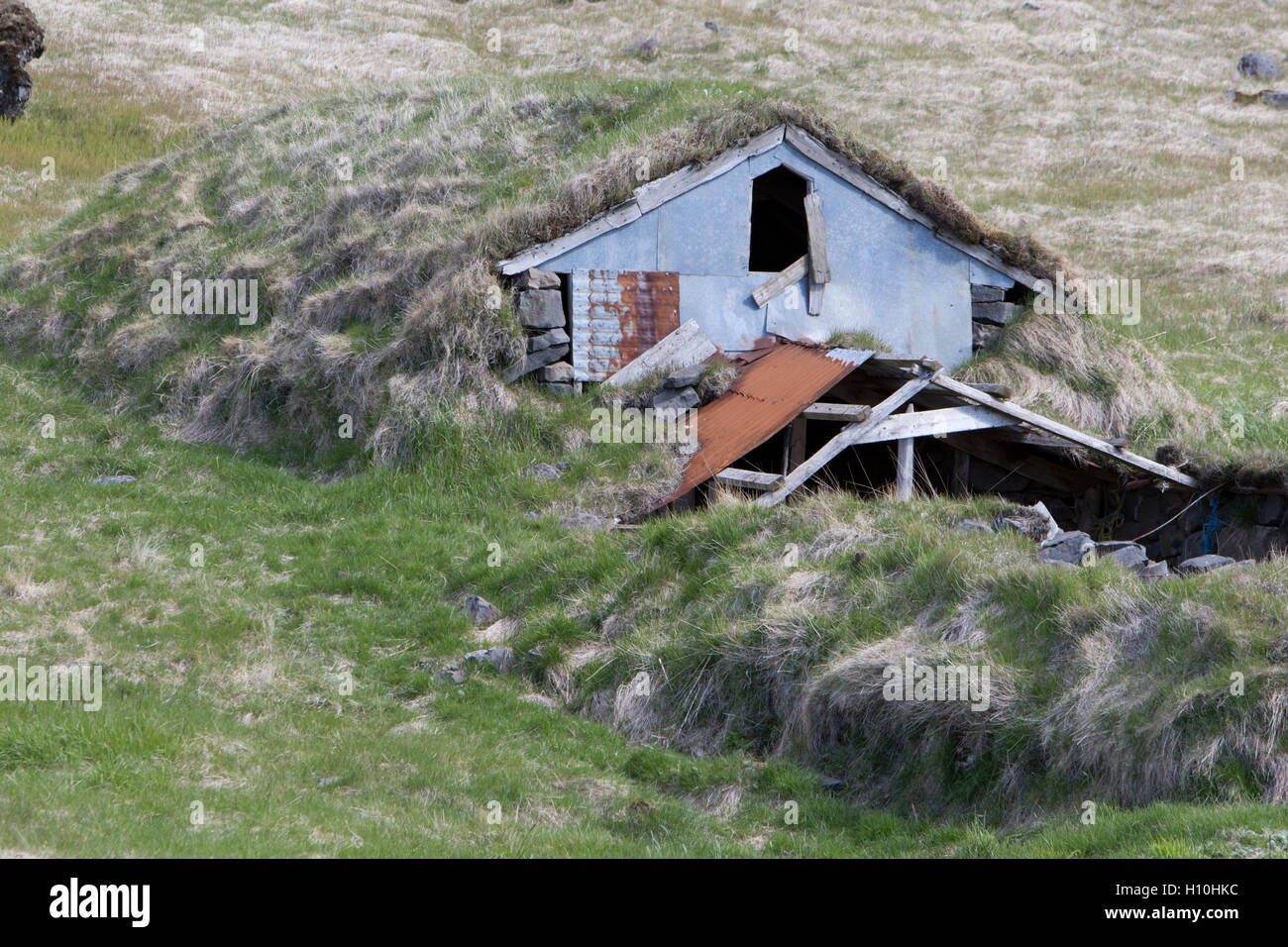 abandoned covered icelandic turf house now used as a field store iceland Stock Photo