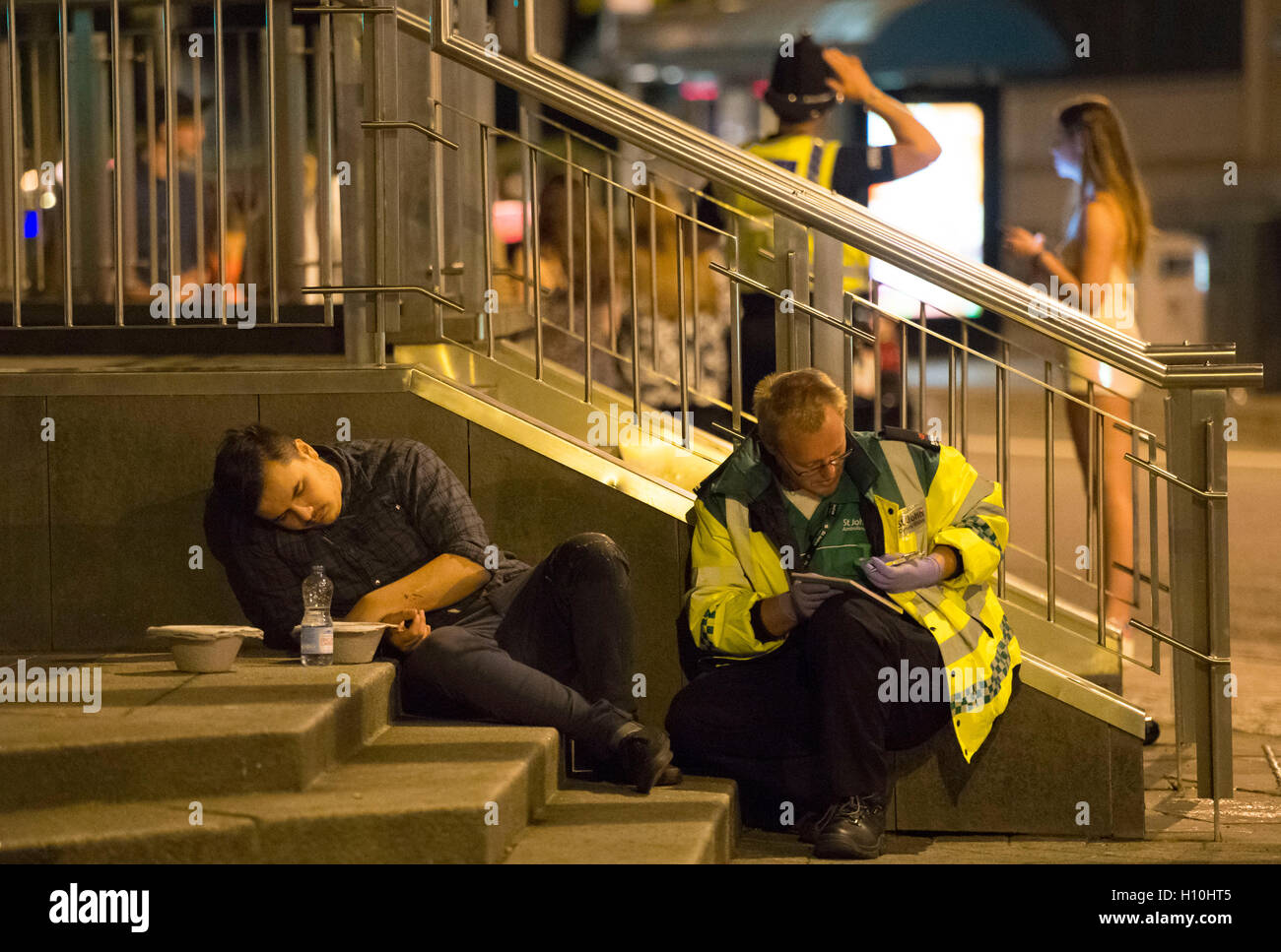 St. John Ambulance crew help a drunk man outside a during