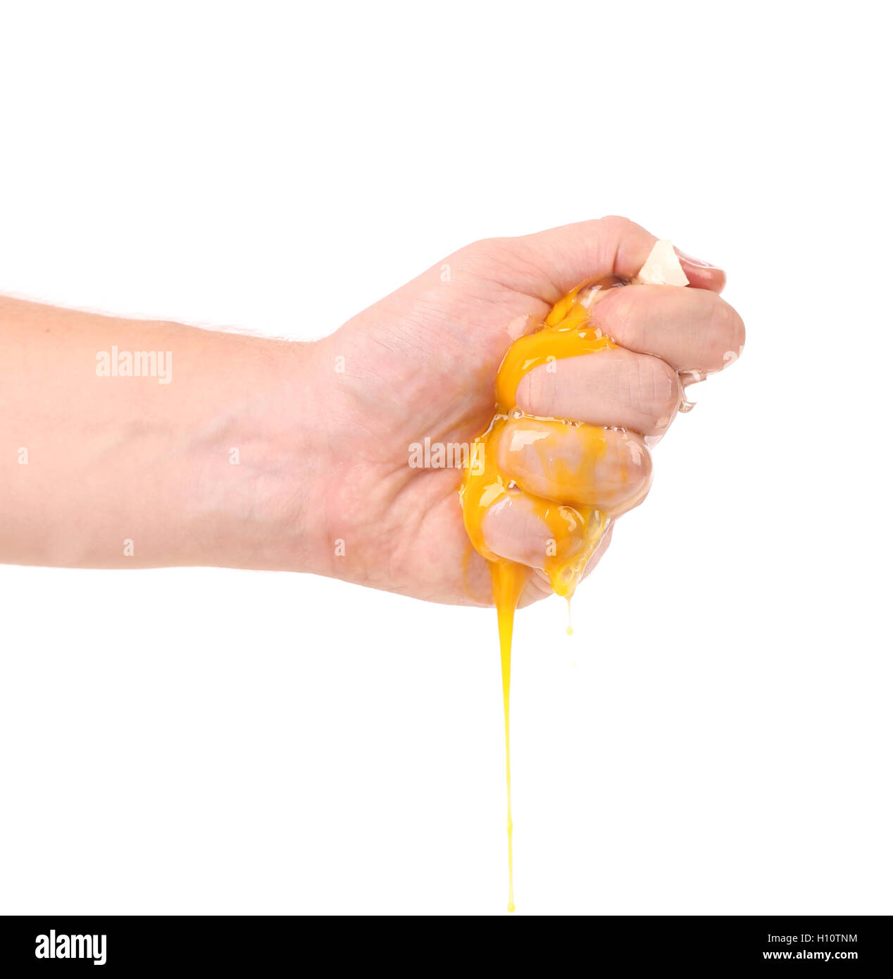 Hand smash egg yolk Stock Photo Alamy