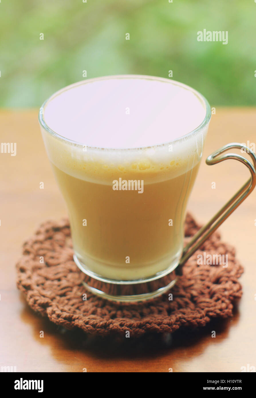 Cup of latte or cappuccino coffee with retro filter effect Stock Photo
