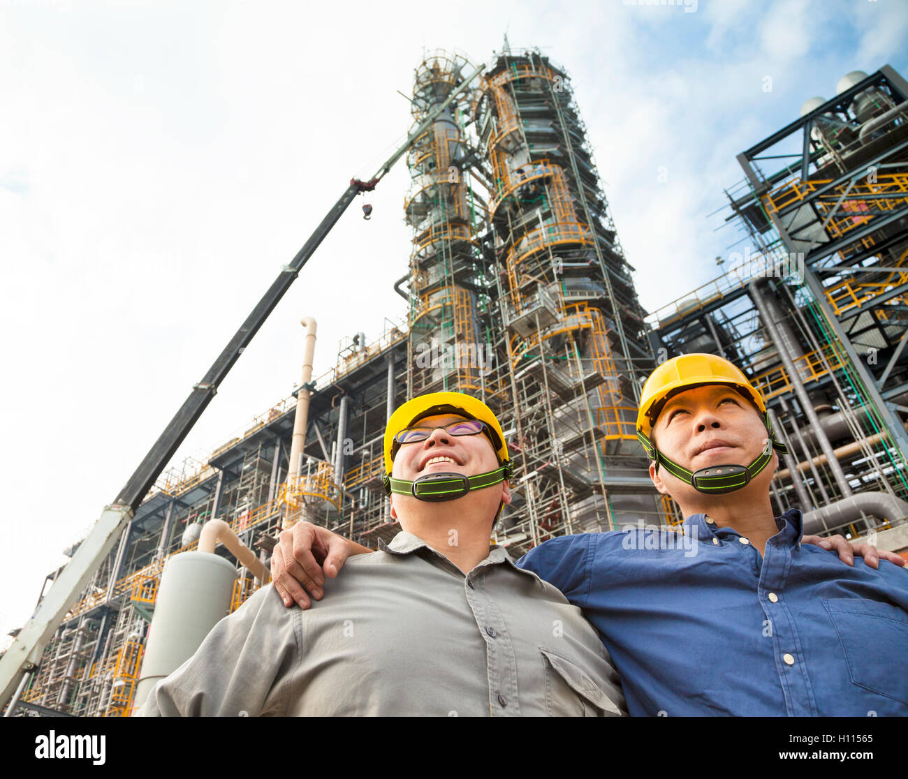 two Factory workers standing together Stock Photo