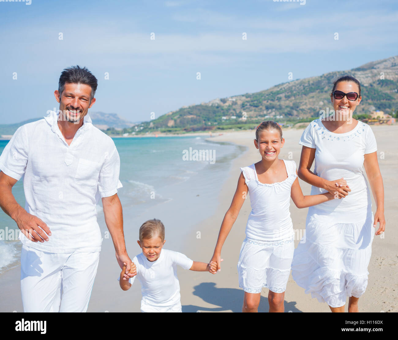 Family having fun on beach Stock Photo