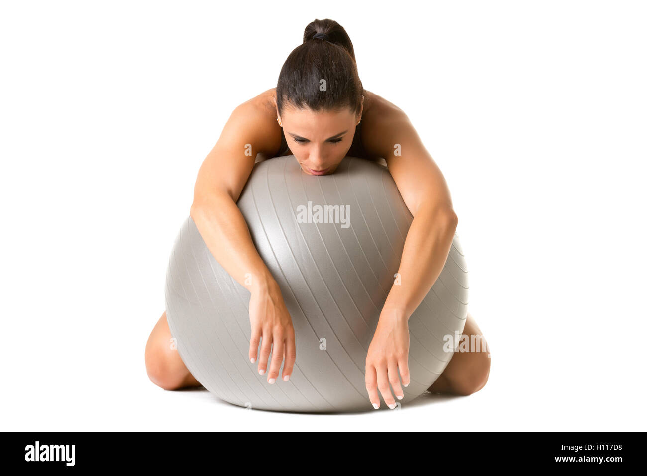 Woman falling asleep in the gym, isolated in white Stock Photo
