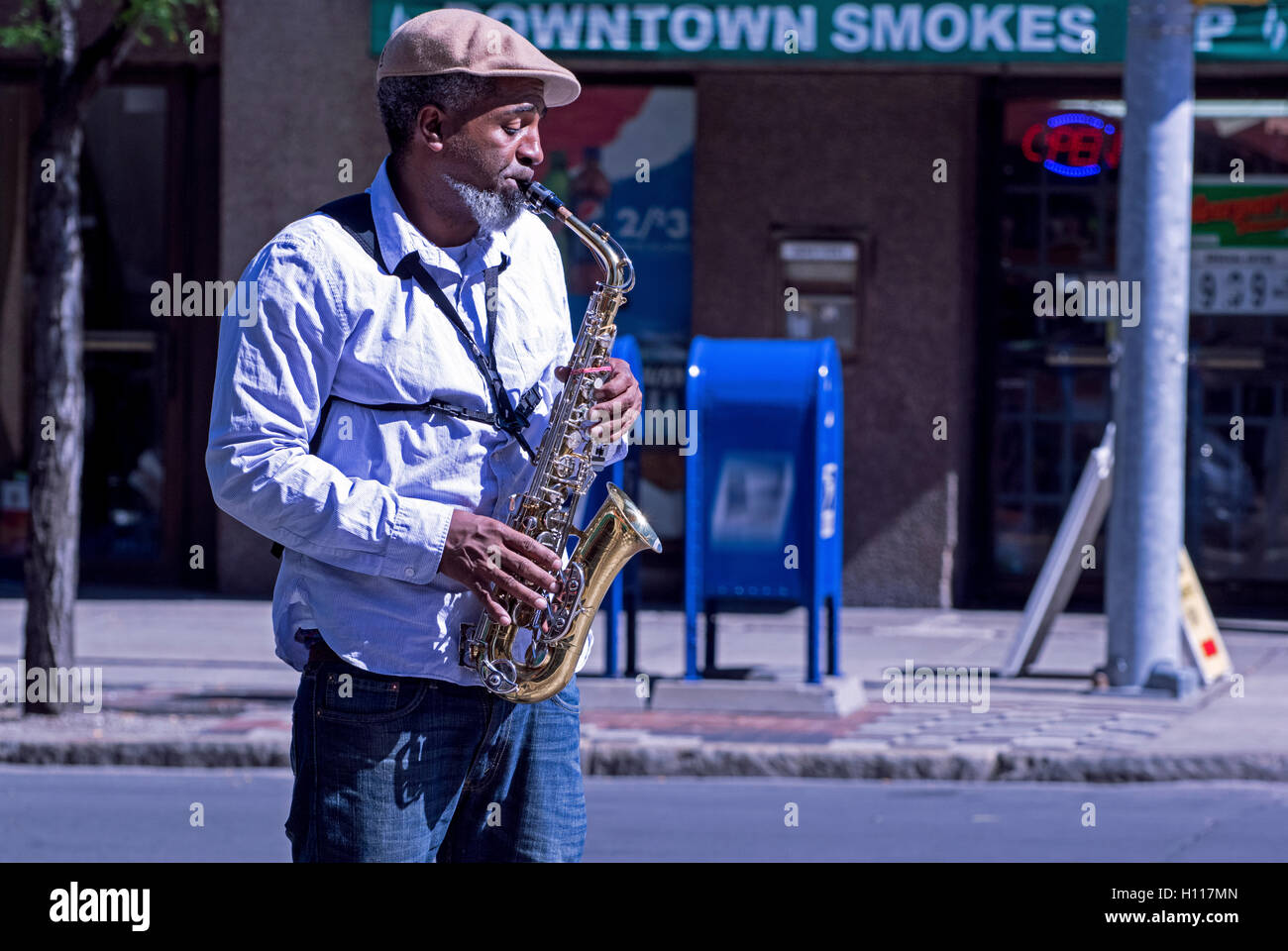 Street performer playing the saxophone Stock Photo Alamy