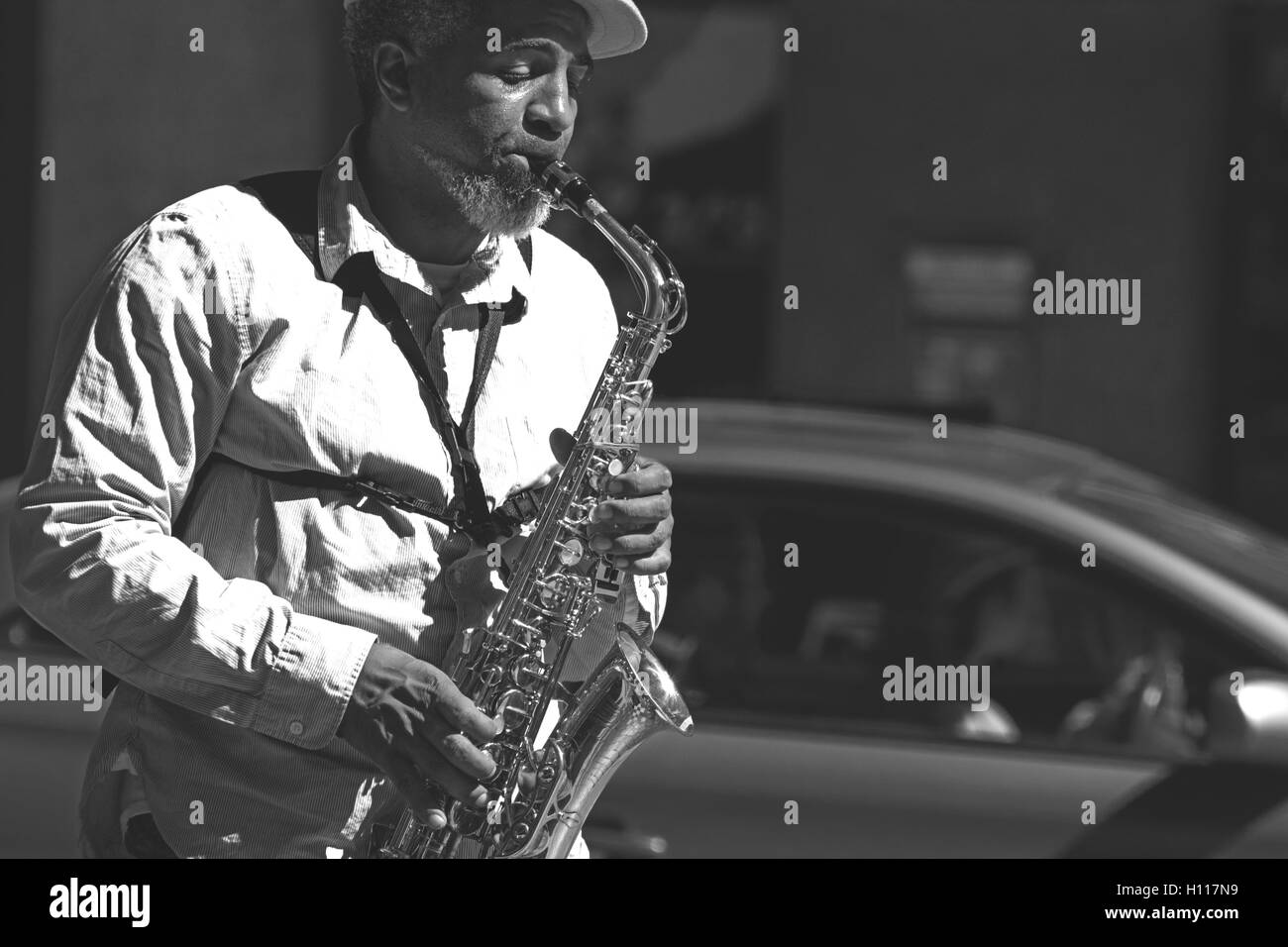 Street performer playing the saxophone Stock Photo