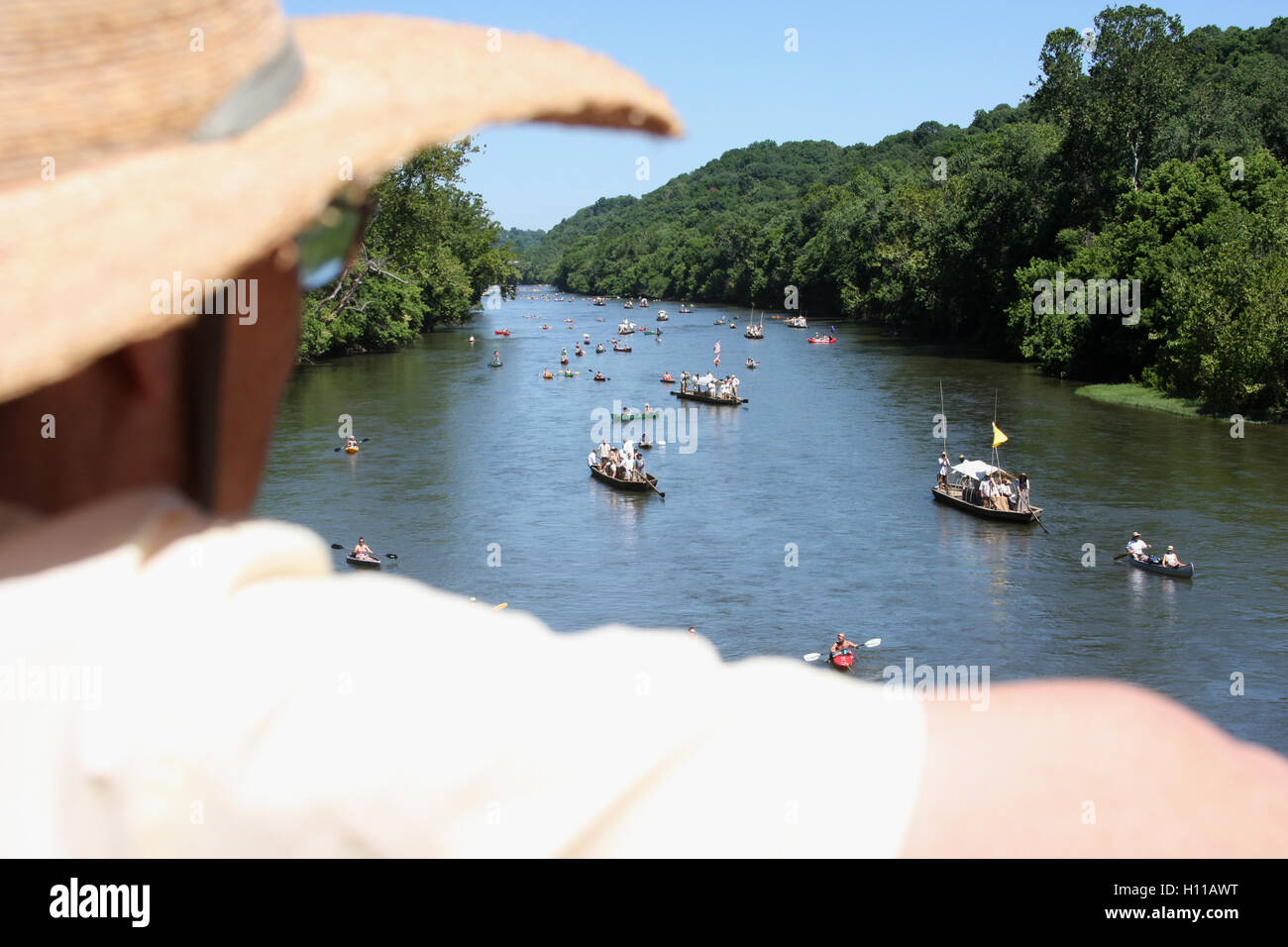 Bystander watching boats floating at the kickof event for the James