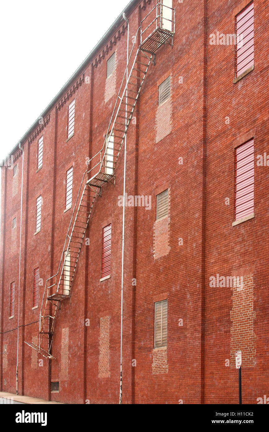 Emergency metal stairs on exterior wall on building in downtown Lynchburg, Virginia, USA Stock Photo