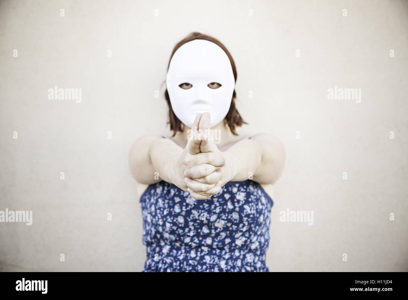 Girl in white mask on halloween, mystery Stock Photo