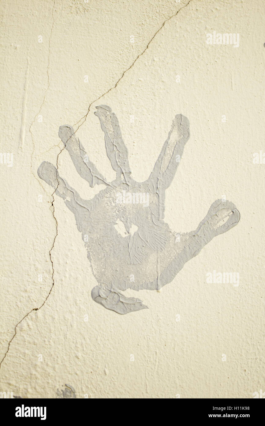 Footprint gray hand painted on wall, symbol Stock Photo - Alamy