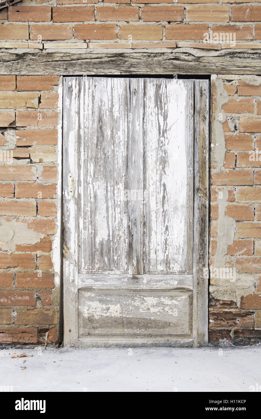 Old wooden door damaged, construction Stock Photo