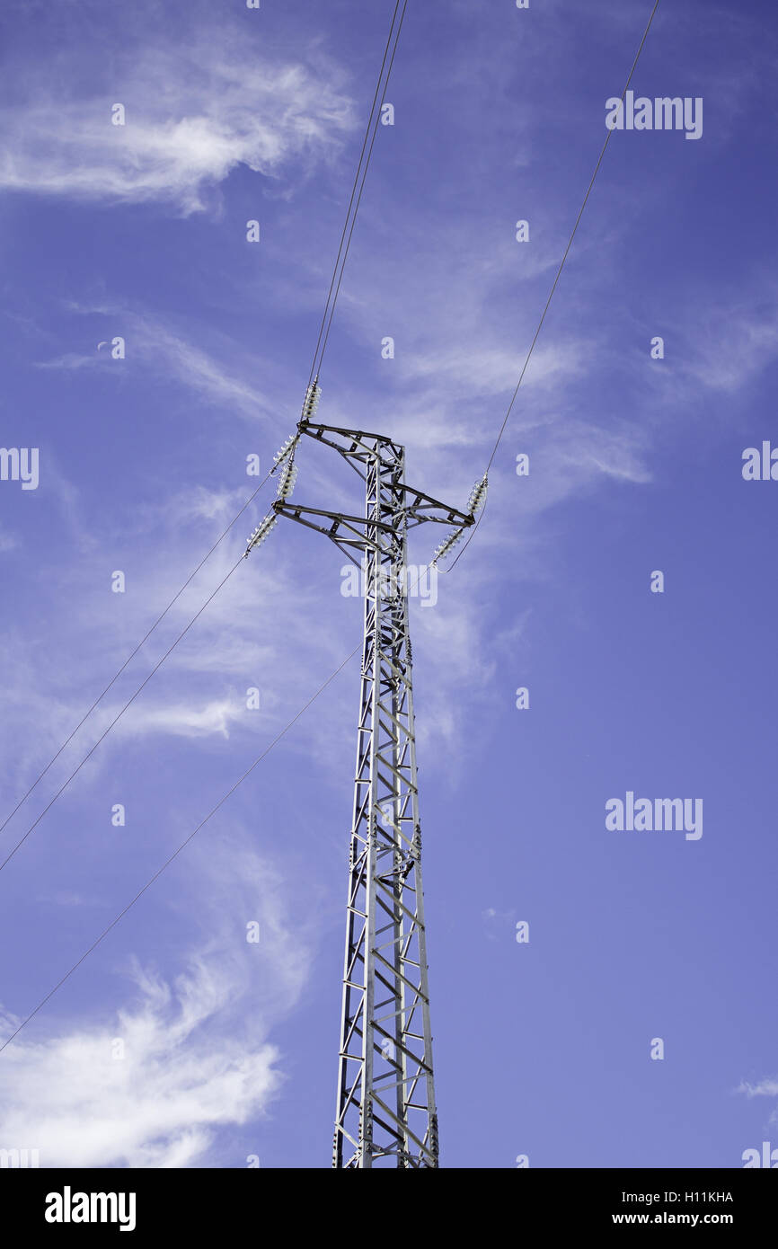 Electricity pylon on blue sky, power and purpose Stock Photo - Alamy