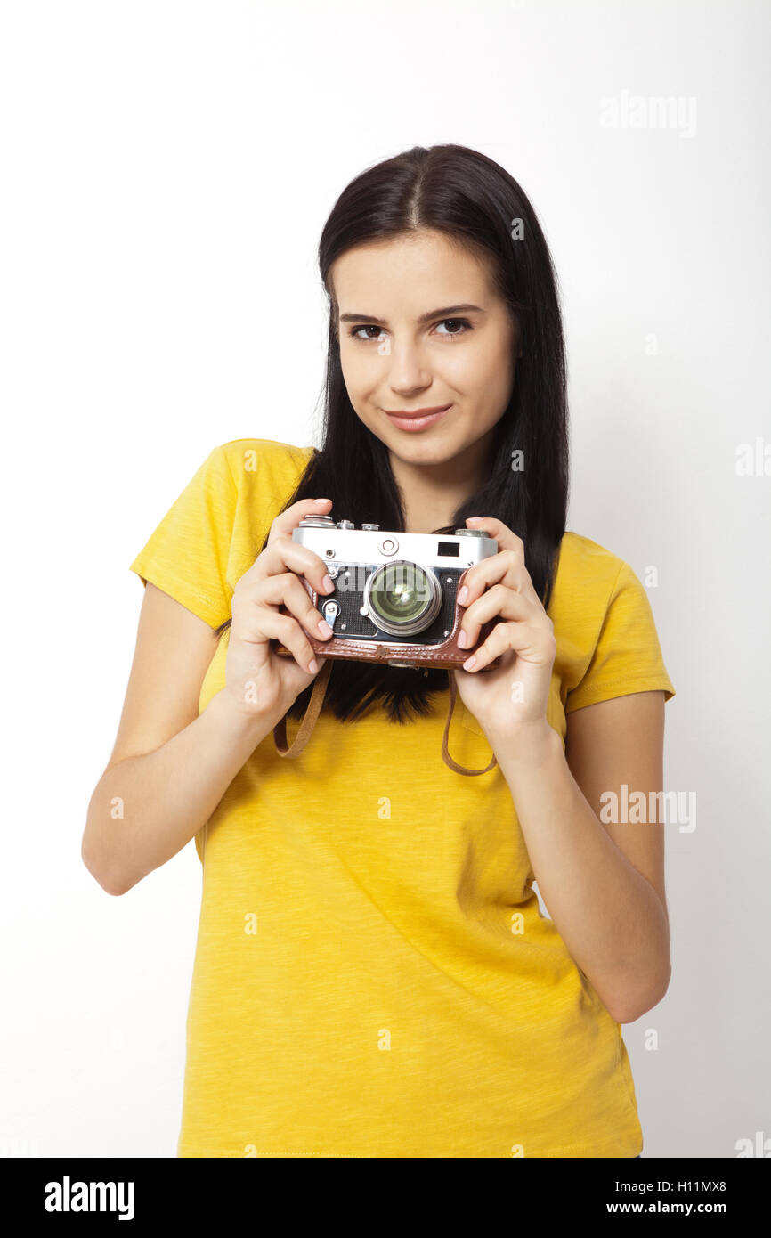 Young Woman Holding retro camera against white background Stock Photo ...