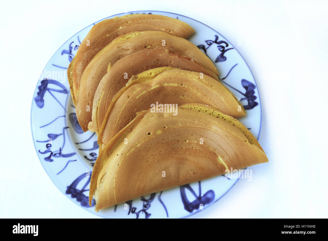 Apam balik, turn over  Malaysian style pancake filled with peanuts, sugar and creamy corn Stock Photo