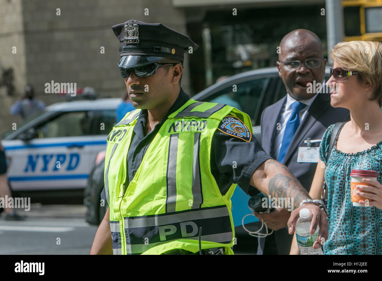 A policeman is directing traffic on the 2nd Avenue during the UN General Assembly. Stock Photo