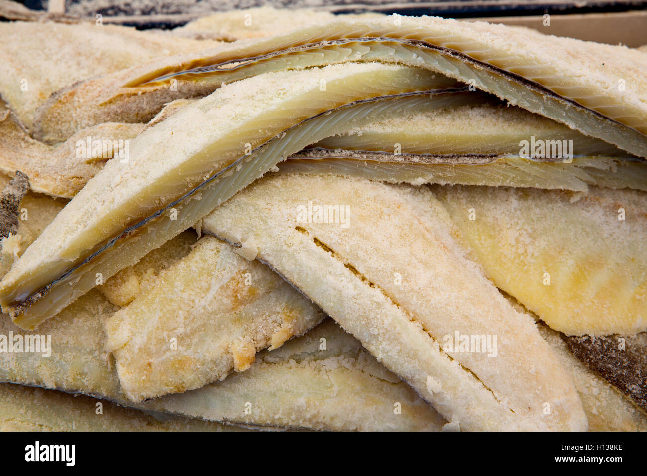 Cod fish salted codfish in a row stacked Stock Photo Alamy