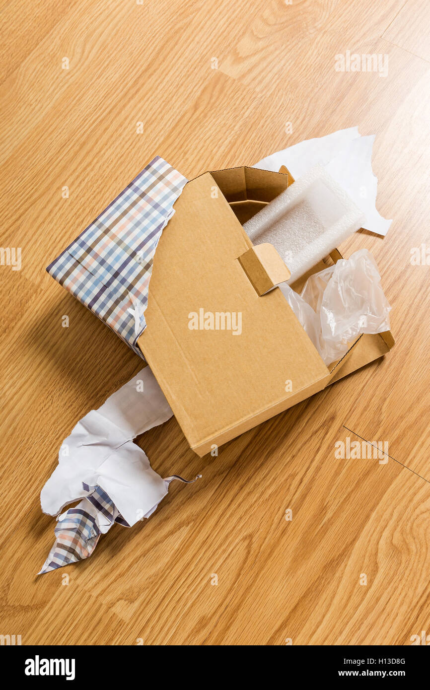 Unwrapped and opened gift box Stock Photo - Alamy