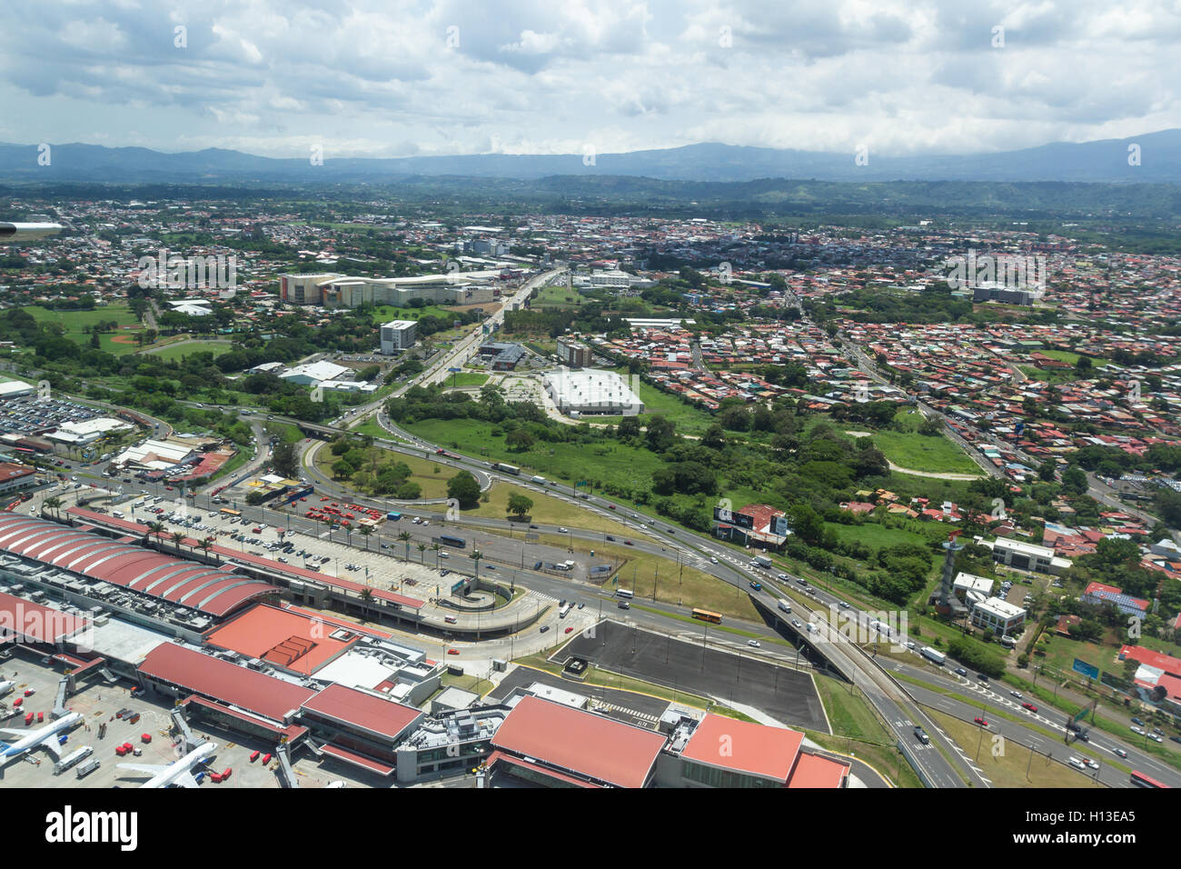 San Jose, Costa Rica - May 24 : aerial view of the city of Alajuela with a partial view of the airport from the interior of a sm Stock Photo